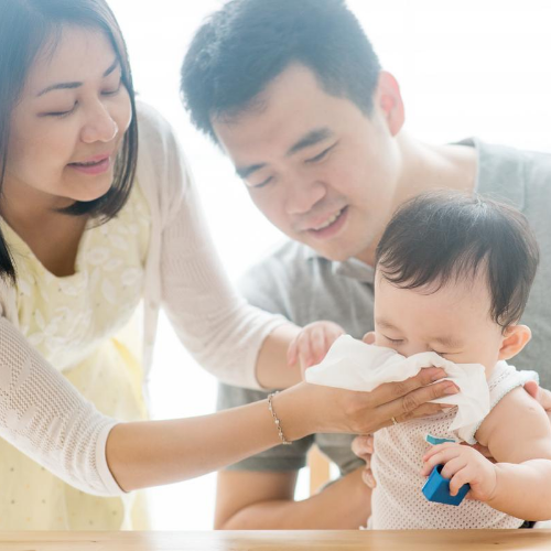 An image of a baby's face which appears to have hives from an allergic reaction.