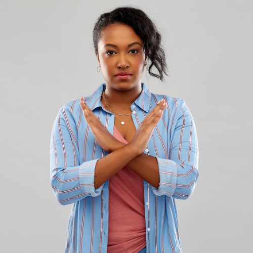  Woman crossing her arms in a "no" sign.